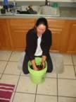 Sharon mixes up the coir (shredded coconut) (82kb)